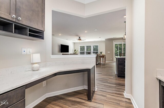 kitchen with dark wood-style floors, dark brown cabinetry, recessed lighting, and baseboards