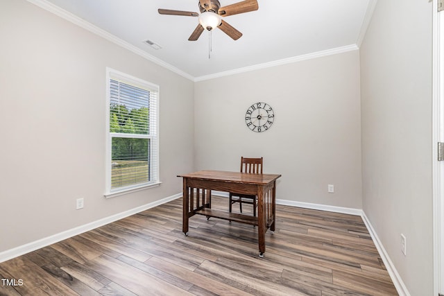 home office with ornamental molding, ceiling fan, baseboards, and wood finished floors