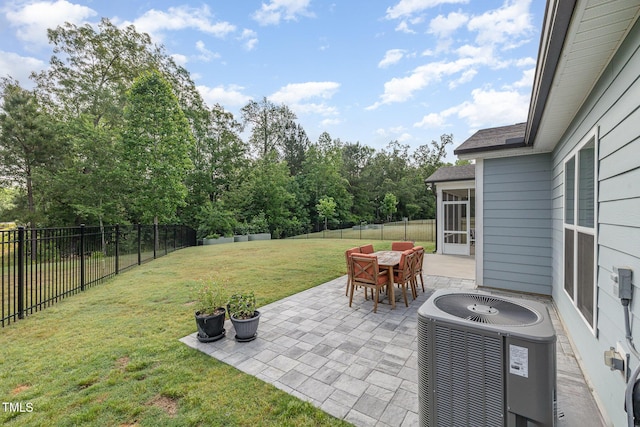 view of patio featuring central AC, outdoor dining area, and a sunroom