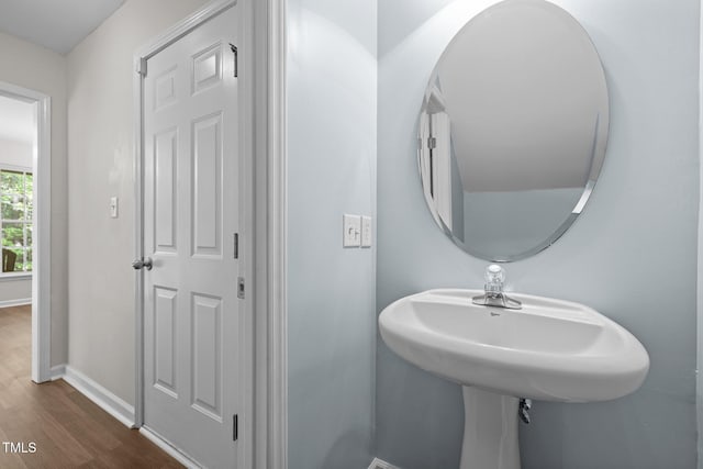 bathroom featuring baseboards and wood finished floors