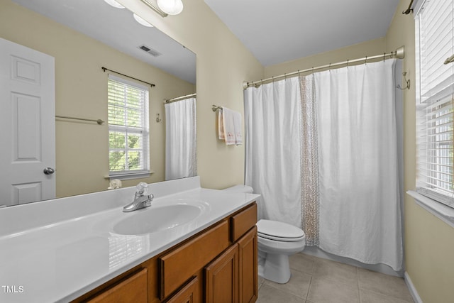 bathroom with visible vents, vanity, toilet, a shower with shower curtain, and tile patterned floors