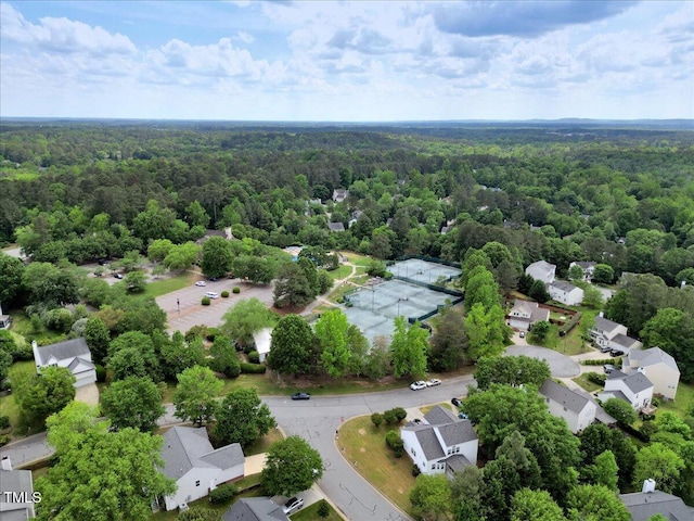 bird's eye view featuring a forest view and a residential view