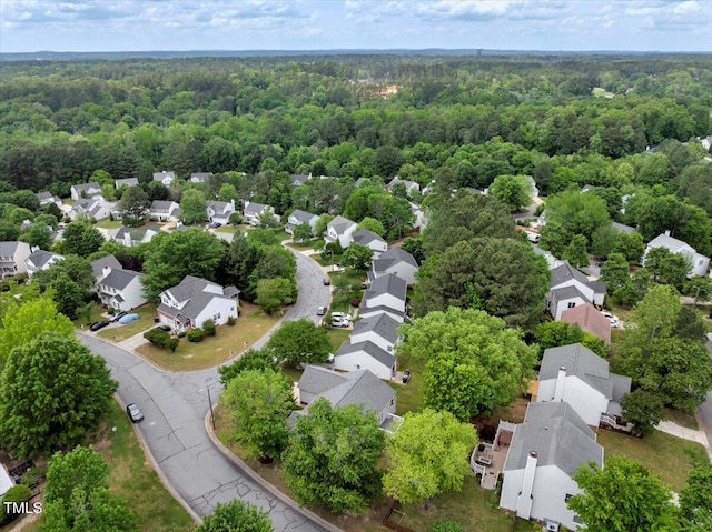 bird's eye view with a forest view and a residential view