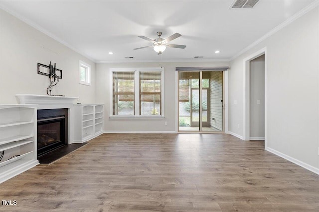 52 Brunello Ct, Clayton, NC 27527 - unfurnished living room featuring crown molding, a ceiling fan, plenty of natural light, and visible vents
