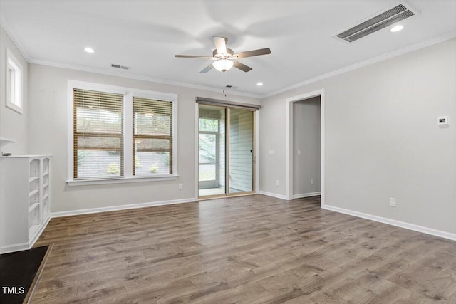 52 Brunello Ct, Clayton, NC 27527 - unfurnished living room with crown molding, ceiling fan, visible vents, and baseboards
