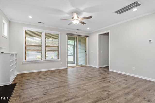 52 Brunello Ct, Clayton, NC 27527 - unfurnished living room with crown molding, ceiling fan, visible vents, and baseboards