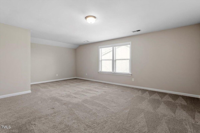 52 Brunello Ct, Clayton, NC 27527 - carpeted empty room featuring baseboards, visible vents, and vaulted ceiling