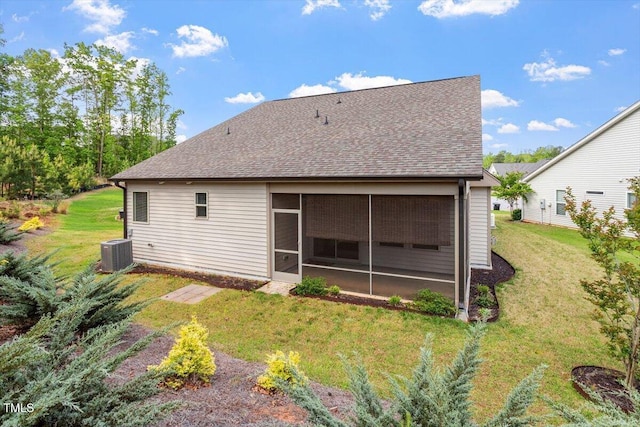 52 Brunello Ct, Clayton, NC 27527 - back of house with a lawn, central AC unit, a shingled roof, and a sunroom