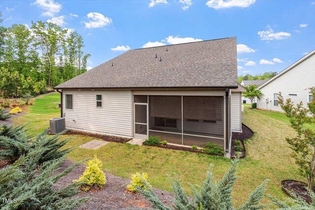 52 Brunello Ct, Clayton, NC 27527 - back of house with a lawn, central AC unit, a shingled roof, and a sunroom