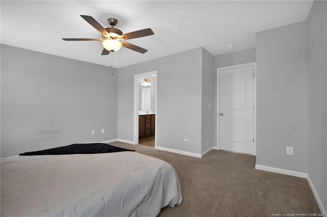 bedroom featuring carpet floors, a ceiling fan, baseboards, and ensuite bathroom