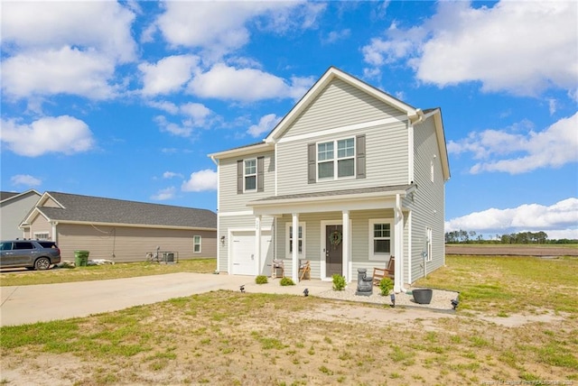view of front of property featuring concrete driveway, an attached garage, and a porch