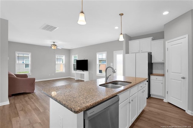 566 Carolina Church Rd, Saint Pauls, NC 28384 - kitchen with a sink, stainless steel dishwasher, plenty of natural light, light wood-style flooring, and recessed lighting