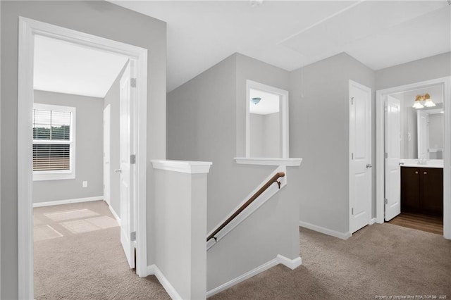 566 Carolina Church Rd, Saint Pauls, NC 28384 - hall featuring an upstairs landing, carpet flooring, and baseboards