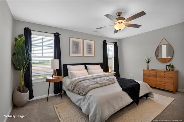 566 Carolina Church Rd, Saint Pauls, NC 28384 - bedroom featuring carpet floors, baseboards, and ceiling fan