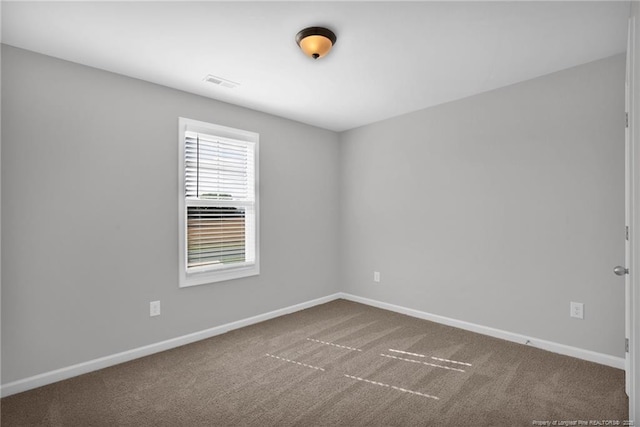 566 Carolina Church Rd, Saint Pauls, NC 28384 - empty room with baseboards and carpet flooring