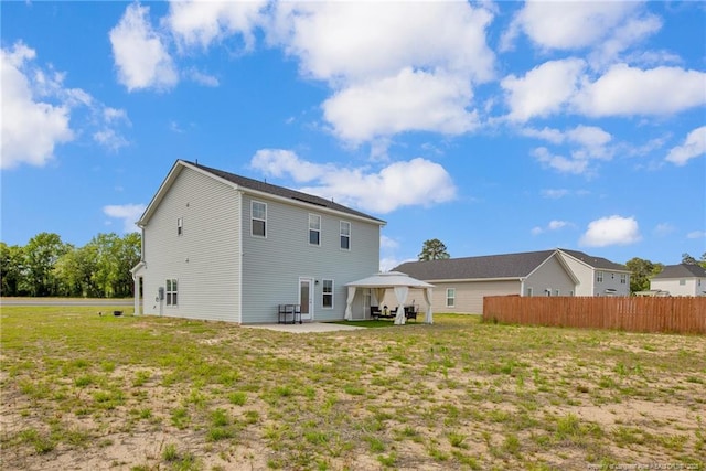 566 Carolina Church Rd, Saint Pauls, NC 28384 - rear view of house featuring a gazebo and a patio area