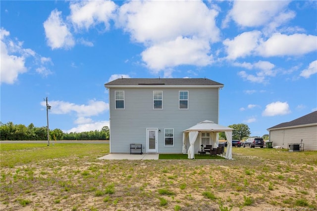 566 Carolina Church Rd, Saint Pauls, NC 28384 - back of house with a gazebo, a patio, cooling unit, and a lawn