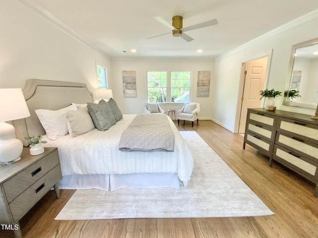bedroom with crown molding, a ceiling fan, baseboards, and wood finished floors