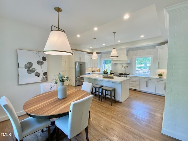 dining area with recessed lighting and light wood-type flooring