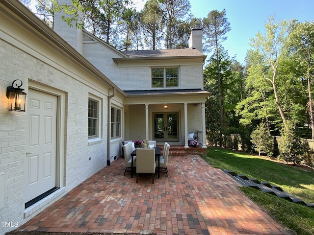 view of patio / terrace featuring french doors and outdoor dining area
