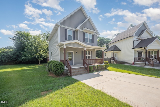 107 Cottage Ct, Youngsville, NC 27596 - craftsman-style house with covered porch, board and batten siding, and a front yard