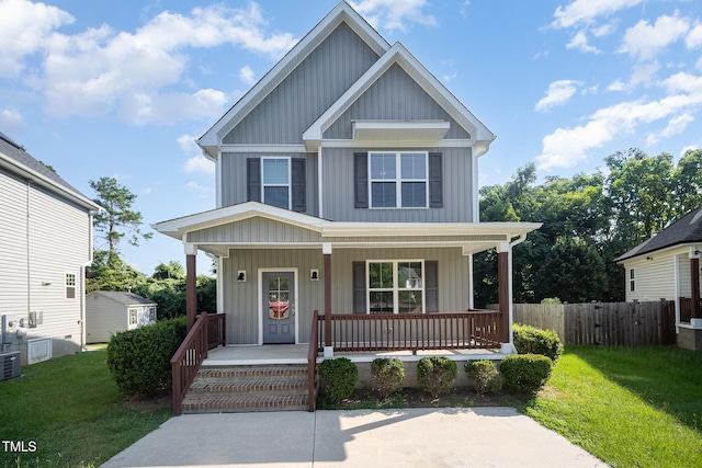 107 Cottage Ct, Youngsville, NC 27596 - view of front facade featuring board and batten siding and a porch