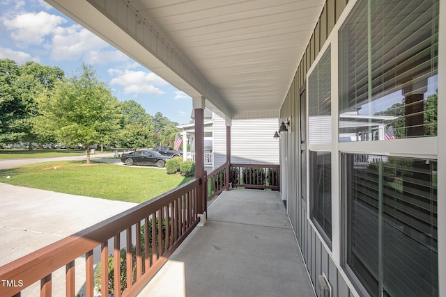107 Cottage Ct, Youngsville, NC 27596 - covered porch with a lawn