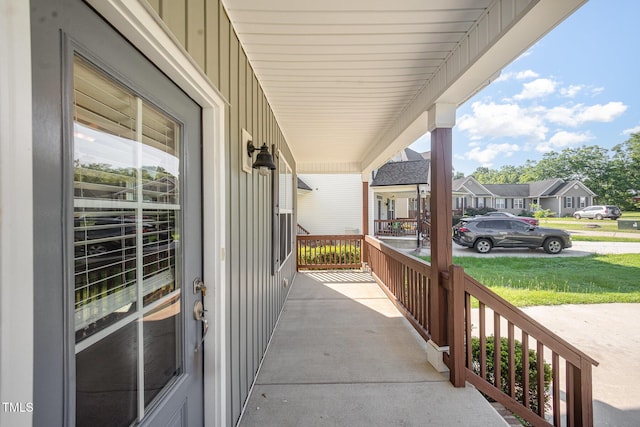 107 Cottage Ct, Youngsville, NC 27596 - covered porch with a residential view