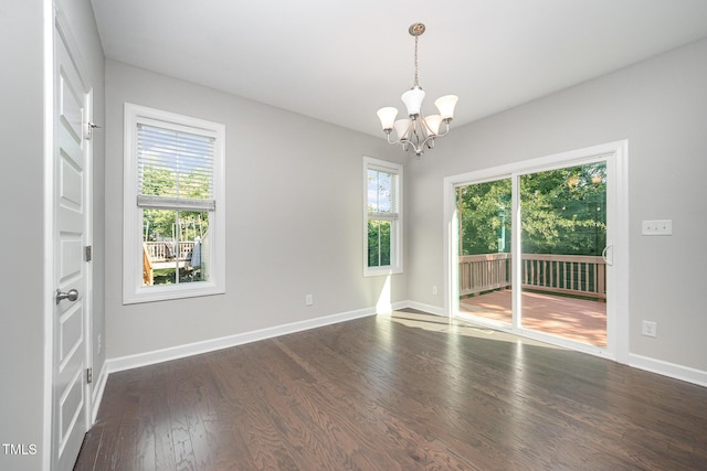 107 Cottage Ct, Youngsville, NC 27596 - empty room with a chandelier, healthy amount of natural light, and dark wood-style flooring