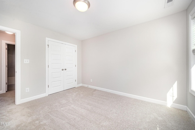107 Cottage Ct, Youngsville, NC 27596 - unfurnished bedroom with carpet floors and a closet