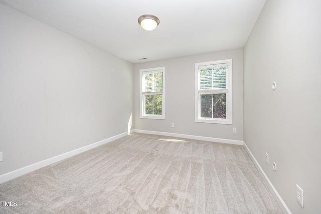 107 Cottage Ct, Youngsville, NC 27596 - empty room featuring baseboards and light colored carpet