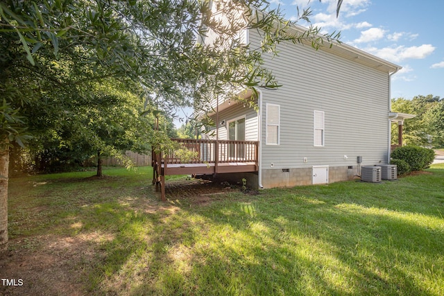 107 Cottage Ct, Youngsville, NC 27596 - view of side of home featuring crawl space, a wooden deck, and a yard
