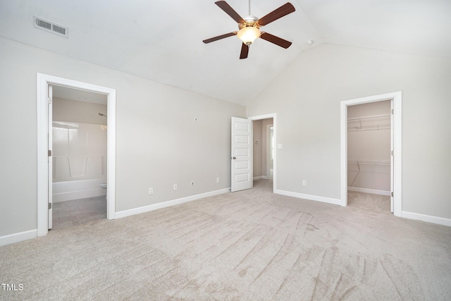 107 Cottage Ct, Youngsville, NC 27596 - unfurnished bedroom featuring vaulted ceiling, carpet floors, a spacious closet, connected bathroom, and a closet