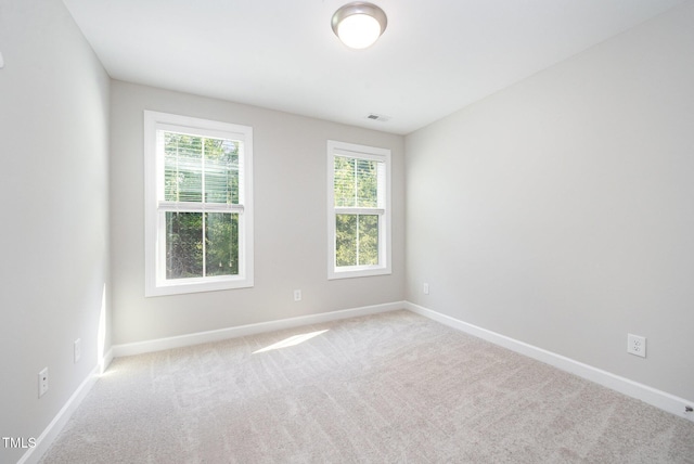 107 Cottage Ct, Youngsville, NC 27596 - spare room featuring baseboards and carpet flooring