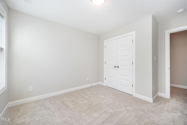 107 Cottage Ct, Youngsville, NC 27596 - unfurnished bedroom with a closet and carpet flooring