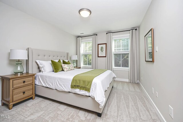 107 Cottage Ct, Youngsville, NC 27596 - bedroom with baseboards and light colored carpet