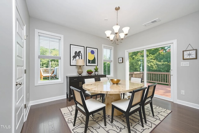 107 Cottage Ct, Youngsville, NC 27596 - dining area with a chandelier, healthy amount of natural light, and dark wood-style floors