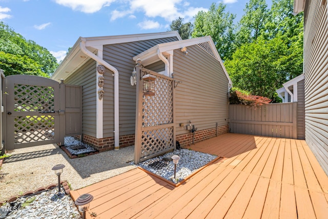 deck with fence and a gate