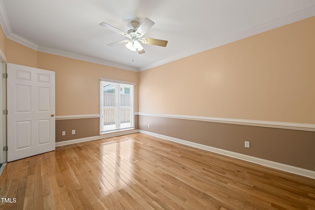 unfurnished room featuring baseboards, a ceiling fan, light wood finished floors, and crown molding
