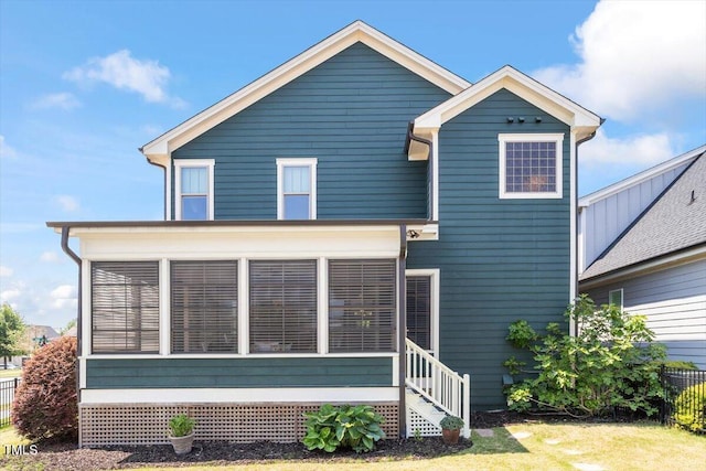 view of front facade featuring a sunroom