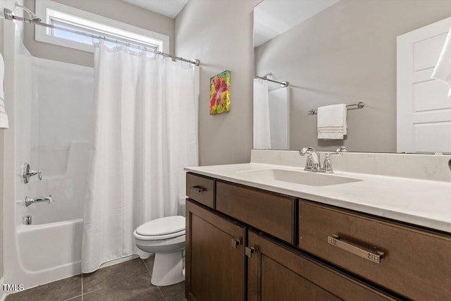 full bathroom featuring vanity, shower / bathtub combination with curtain, tile patterned floors, and toilet