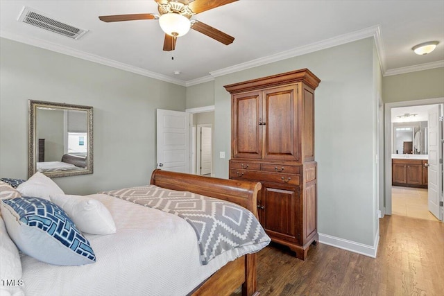 bedroom with a ceiling fan, dark wood-style flooring, visible vents, crown molding, and baseboards