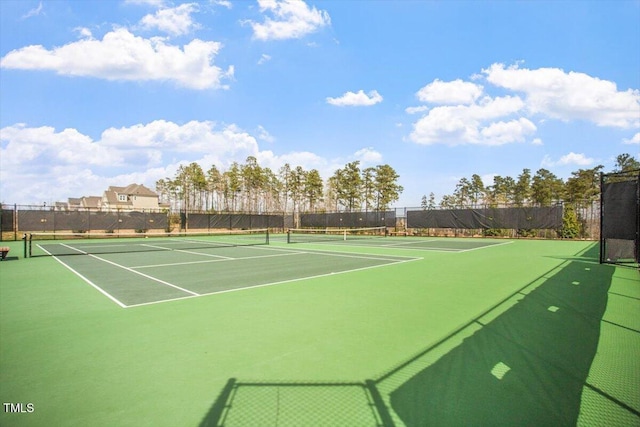 view of sport court with fence