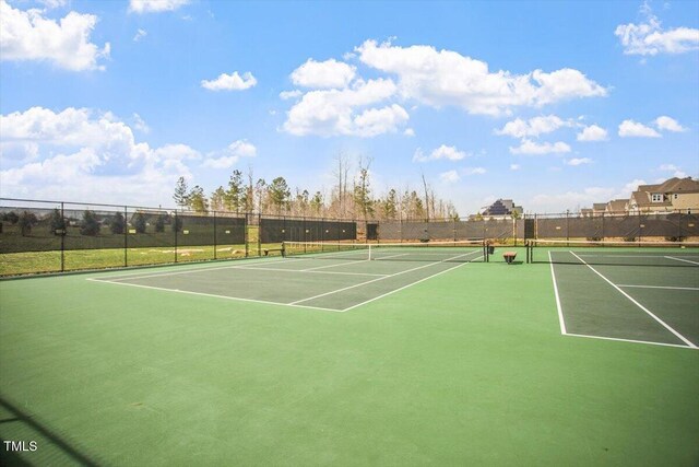 view of sport court with fence