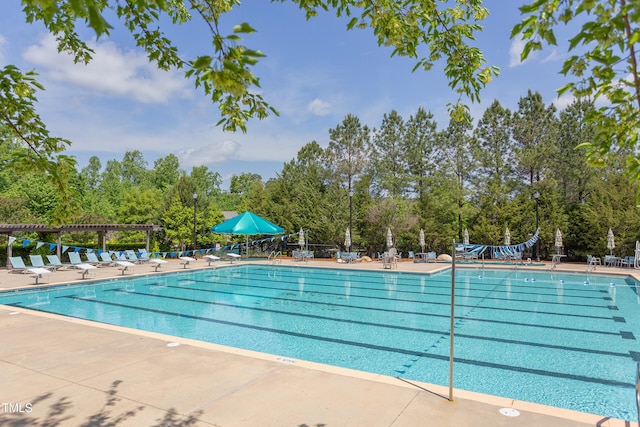 12 Beacon Ridge Blvd, Chapel Hill, NC 27516 - community pool with view of scattered trees and a patio area