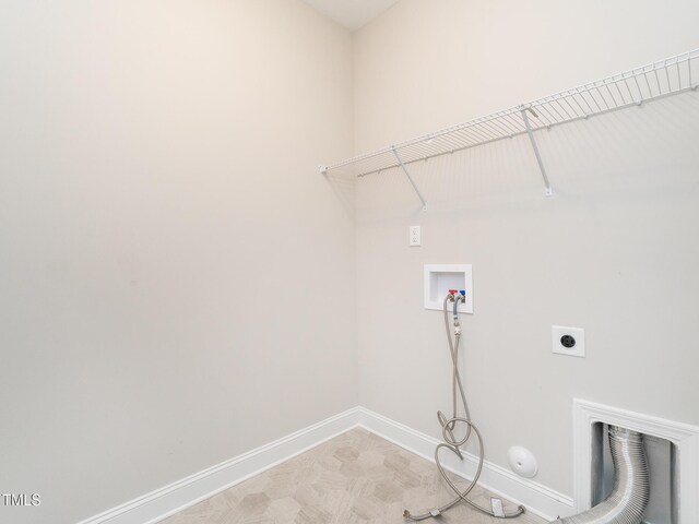 washroom featuring laundry area, hookup for a gas dryer, electric dryer hookup, baseboards, and hookup for a washing machine