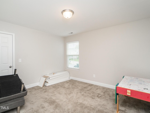 interior space featuring baseboards and carpet flooring