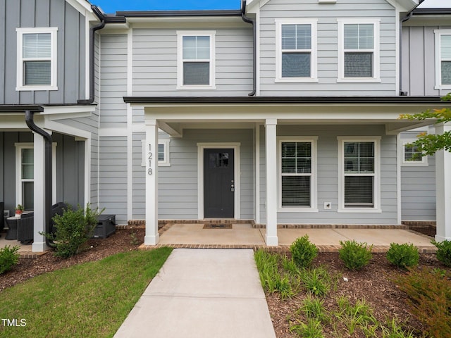 1218 S Franklin St, Wake Forest, NC 27587 - view of front of home with board and batten siding and covered porch