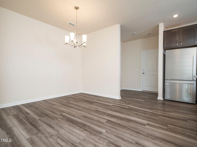 1218 S Franklin St, Wake Forest, NC 27587 - unfurnished dining area featuring a chandelier, dark wood-style flooring, baseboards, and recessed lighting