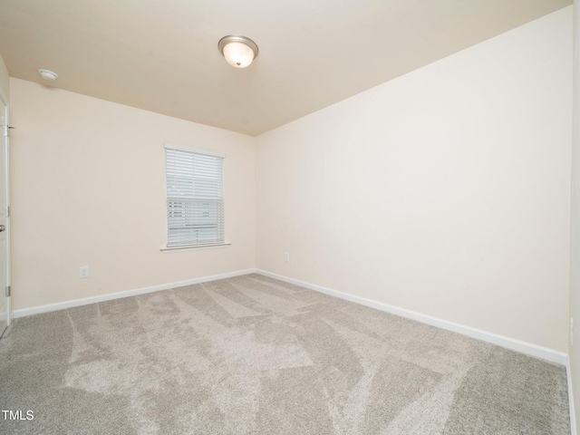 1218 S Franklin St, Wake Forest, NC 27587 - empty room with light colored carpet, baseboards, and a smoke detector